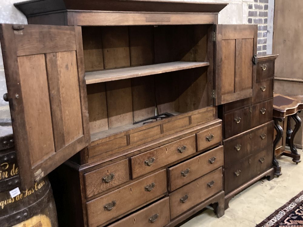 A George III oak housekeepers cupboard, width 138cm depth 52cm height 174cm